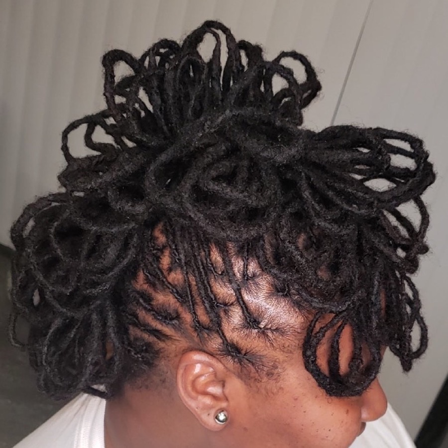 Locs styling with defined parts at SheBeenHair East York